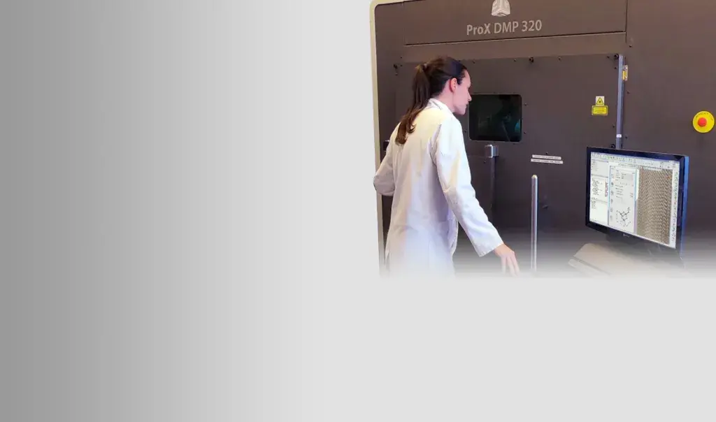 Researcher at the KU Leuven metal AM research lab using the 3D Systems ProX® DMP 320 printer